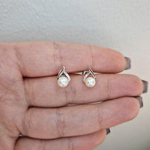  Örhängen i vitguld med pärla och diamanter