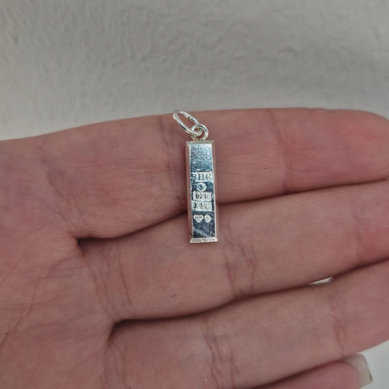 Silvertacka hängsmycke