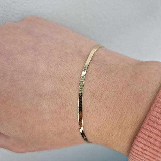 Armband manglad 18k guld